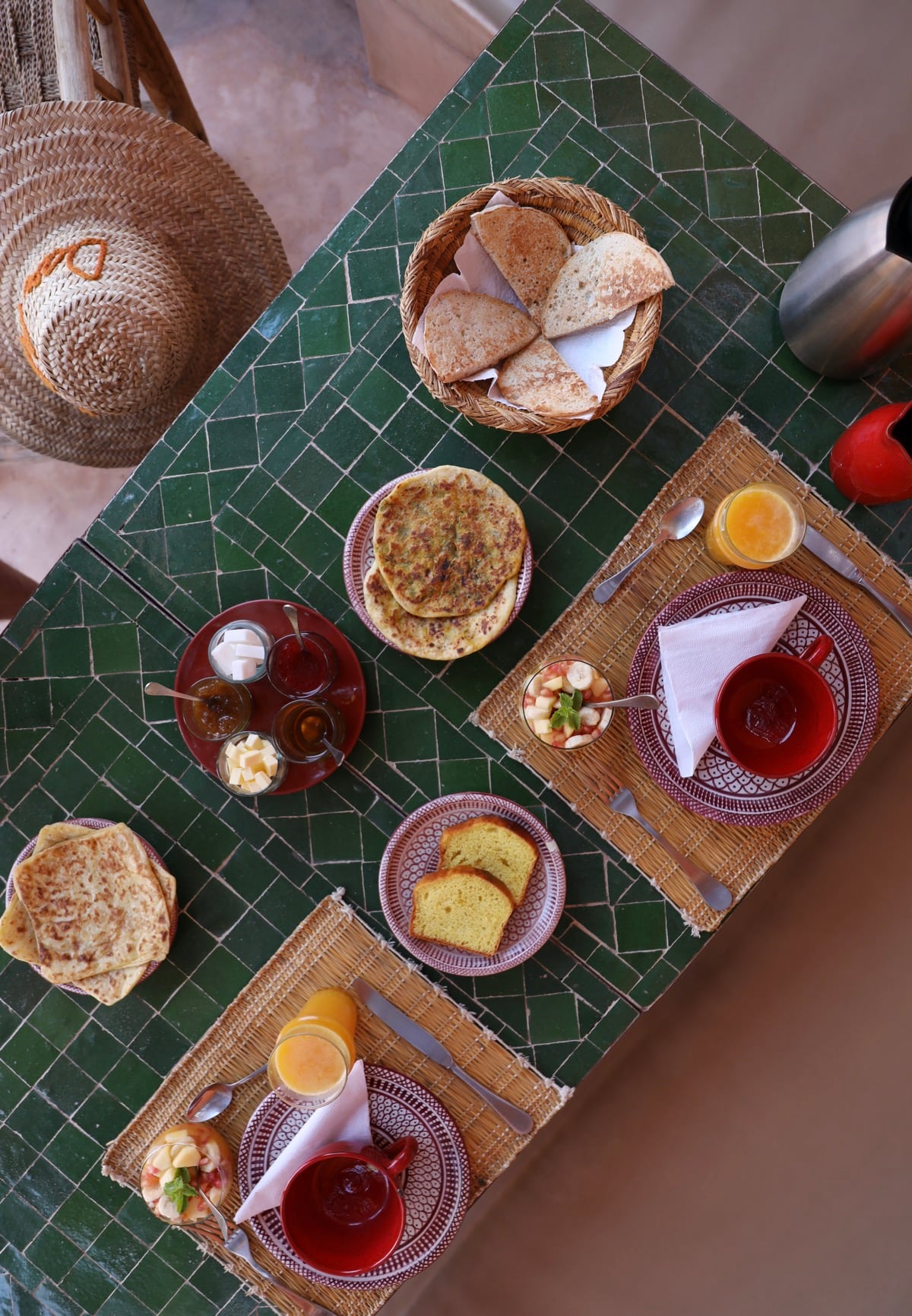 A Moroccan breakfast arranged on a green zellige table
