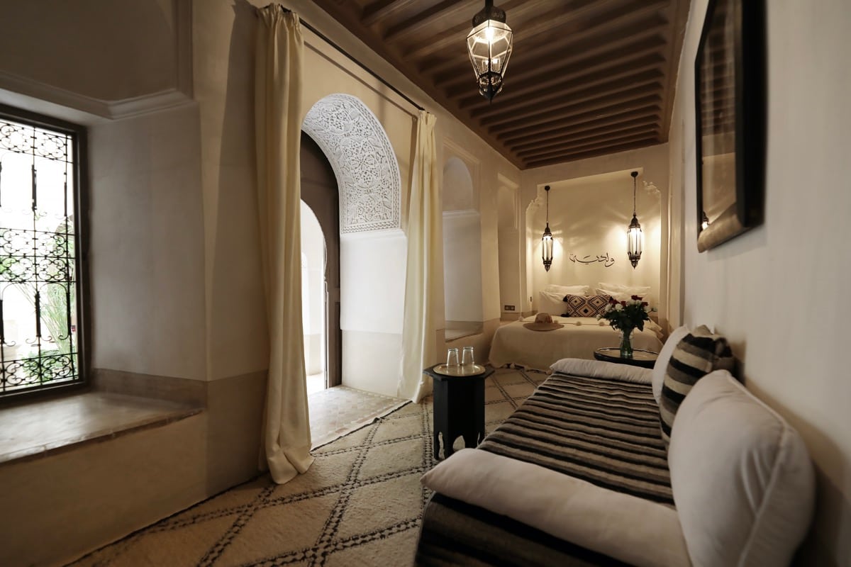 The Oualidia room opening through a carved arch